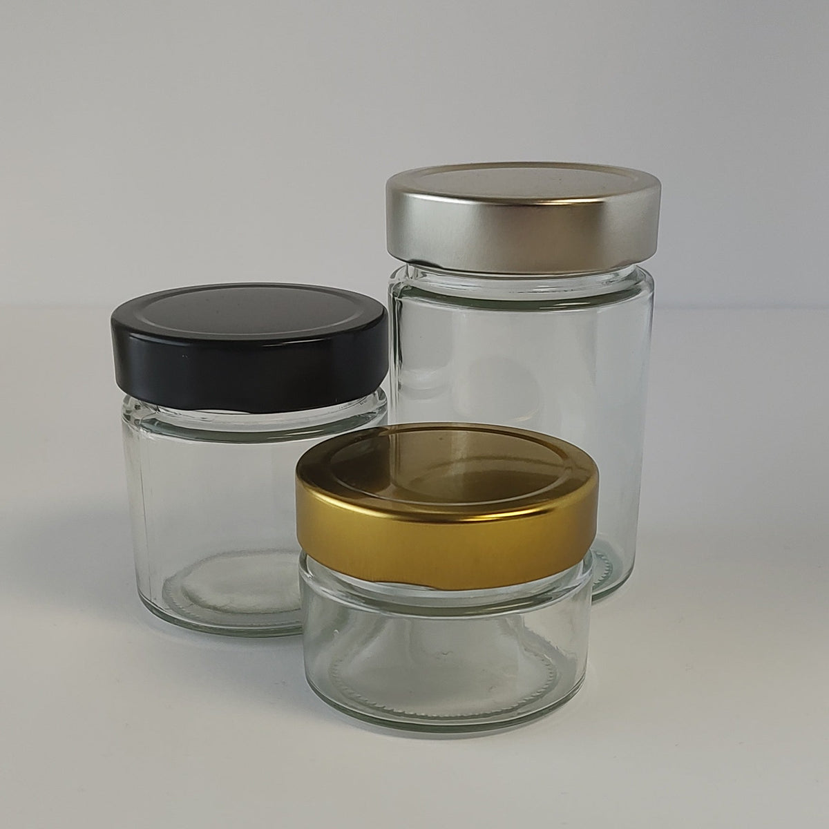 150ml Bottle Source Corporation Ergo glass jar with a 70mm metal cap, clear container for storage or display.
