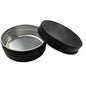 Metal tin with black lid on a white background
