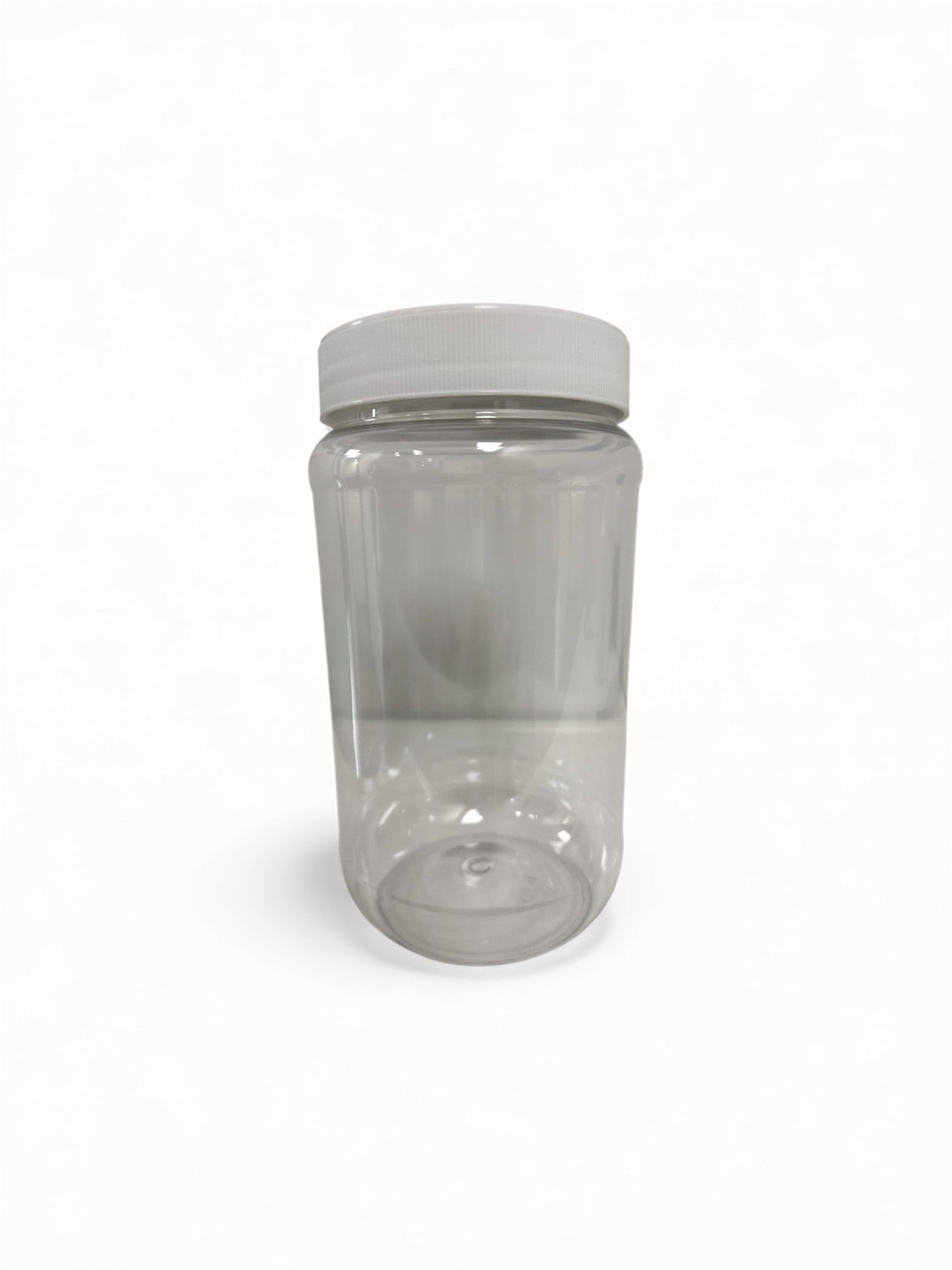 Clear plastic jar with a white lid on a white background