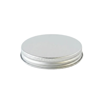 Silver metal cap for a jar on a white background